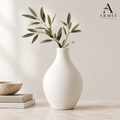 Matte white ceramic vase with ARMST logo